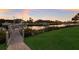 Waterfront property featuring a private boat dock, green lawn, and tranquil canal views at 11739 River Shores Trl, Parrish, FL 34219
