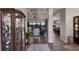 Inviting foyer with views into the living and dining areas, and beautiful decor at 11739 River Shores Trl, Parrish, FL 34219