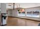 Light-filled gym with hardwood floors and expansive windows showcasing a sparkling pool, perfect for a refreshing workout at 11739 River Shores Trl, Parrish, FL 34219