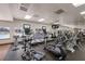 State-of-the-art gym featuring cardio machines with individual screens and ample workout space for an active lifestyle at 11739 River Shores Trl, Parrish, FL 34219