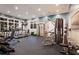 Well-equipped gym featuring treadmills, weight machines, and ample space for exercise at 11739 River Shores Trl, Parrish, FL 34219
