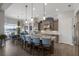 Modern kitchen with stainless steel appliances, granite countertops, and an island with seating at 11739 River Shores Trl, Parrish, FL 34219