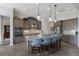 Modern kitchen with stainless appliances, granite counters, and a large island with seating, providing a stylish culinary space at 11739 River Shores Trl, Parrish, FL 34219