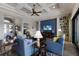 Comfortable living room with coffered ceiling, stylish furniture, and a view of the pool at 11739 River Shores Trl, Parrish, FL 34219