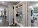 Well-organized mudroom with built-in shelving, hooks, and a convenient bench at 11739 River Shores Trl, Parrish, FL 34219