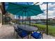 Outdoor patio with waterfront views, perfect for alfresco dining at 11739 River Shores Trl, Parrish, FL 34219