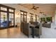 Inviting covered patio with comfortable seating, ceiling fans, and a view of the outdoors at 11739 River Shores Trl, Parrish, FL 34219