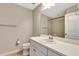 Bright bathroom featuring white cabinets, an integrated sink, and a walk-in shower at 11831 Brookside Dr, Bradenton, FL 34211