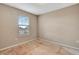 An unfinished bedroom space featuring neutral paint, one window, and natural light at 11831 Brookside Dr, Bradenton, FL 34211