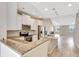Beautiful open kitchen featuring granite countertops, stainless steel appliances, and tile flooring at 11831 Brookside Dr, Bradenton, FL 34211