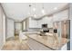 Beautiful kitchen featuring stainless steel appliances, granite countertops, and a large island at 11831 Brookside Dr, Bradenton, FL 34211