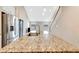 Contemporary kitchen with granite countertops, stainless steel appliances, and open to the living area at 11831 Brookside Dr, Bradenton, FL 34211