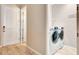 Convenient laundry room featuring a washer, dryer, and easy access to the entry of the house at 11831 Brookside Dr, Bradenton, FL 34211