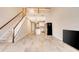 Bright living room featuring a staircase, high ceilings and an open concept kitchen at 11831 Brookside Dr, Bradenton, FL 34211