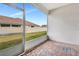 Covered patio displays a serene view of the backyard and provides a relaxing space to enjoy at 11831 Brookside Dr, Bradenton, FL 34211