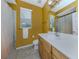 Bathroom with a tub/shower combo, toilet, and single sink vanity at 12022 Granite Woods Loop, Venice, FL 34292