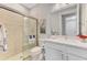 Bathroom with a glass-enclosed shower, white vanity, and stylish decor for a modern look at 12448 Golden Sage Dr, Sarasota, FL 34238