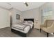 Neutral bedroom with ensuite and seating area with a view at 12448 Golden Sage Dr, Sarasota, FL 34238
