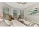 Bedroom features a seating area with large windows providing natural light at 12448 Golden Sage Dr, Sarasota, FL 34238