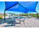 Bocce ball court featuring shaded seating, tables, and a well-maintained paver patio at 12448 Golden Sage Dr, Sarasota, FL 34238