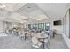 Clubhouse dining area featuring elegant decor, comfortable seating, and large windows at 12448 Golden Sage Dr, Sarasota, FL 34238