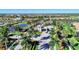 An aerial view of the community entrance showcasing lush landscaping and a secure gatehouse at 12448 Golden Sage Dr, Sarasota, FL 34238