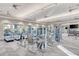 Well-equipped gym with modern exercise machines, treadmills, weights, and ceiling fans at 12448 Golden Sage Dr, Sarasota, FL 34238