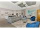 Open floorplan: living room flows into the gourmet kitchen with an oversized island and state-of-the-art appliances at 12448 Golden Sage Dr, Sarasota, FL 34238