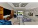 Open-concept living room with a modern ceiling fan, recessed lighting, and plush seating at 12448 Golden Sage Dr, Sarasota, FL 34238