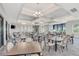This meeting room features tables, chairs, and elegant chandeliers, perfect for gatherings and events at 12448 Golden Sage Dr, Sarasota, FL 34238