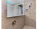 Tiled shower with glass partition and built-in niche for toiletries at 12448 Golden Sage Dr, Sarasota, FL 34238