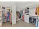 Large walk-in closet with custom shelving and ample storage space at 12448 Golden Sage Dr, Sarasota, FL 34238