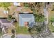 This property boasts a large, well-maintained yard, complemented by mature trees and a charming brick patio at 1302 5Th W St, Palmetto, FL 34221