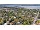 High-angle shot of a quaint neighborhood with lush vegetation, buildings and boats in the distance at 1302 5Th W St, Palmetto, FL 34221