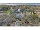 A lovely neighborhood view showcases lush trees, well-maintained homes, and a glimpse of the bay in the distance at 1302 5Th W St, Palmetto, FL 34221