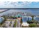 Elevated aerial view of building near marina with many boats and a bridge, parking lot and buildings at 1302 5Th W St, Palmetto, FL 34221