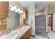 Bathroom features a dual sink vanity, light fixtures, and a shower at 1302 5Th W St, Palmetto, FL 34221
