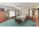 Bright bedroom features a ceiling fan, two windows, and ample closet space at 1302 5Th W St, Palmetto, FL 34221