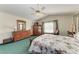 Vaulted ceiling bedroom features a ceiling fan and carpet floors at 1302 5Th W St, Palmetto, FL 34221