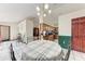 Bright dining room with table and chairs, visible kitchen, and entryways to other rooms at 1302 5Th W St, Palmetto, FL 34221