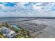 Aerial shot of a marina with boats and water with buildings and a bridge in the distance at 1302 5Th W St, Palmetto, FL 34221