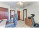 Home office featuring tiled floors, ceiling fan, and views into other rooms at 1302 5Th W St, Palmetto, FL 34221
