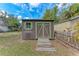 Well maintained shed with a dark brown color and light green trim at 1302 5Th W St, Palmetto, FL 34221