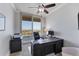 Office with large desk, ceiling fan and balcony access with a fantastic view at 140 Riviera Dunes Way # 1203, Palmetto, FL 34221