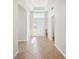 Bright foyer showcasing tile flooring, transom window, and elegant architectural details, creating a welcoming entry at 14150 Cattle Egret Pl, Lakewood Ranch, FL 34202