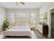 Serene bedroom with soft lighting, neutral decor, and large windows, creating a relaxing retreat at 14150 Cattle Egret Pl, Lakewood Ranch, FL 34202