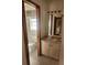 Clean bathroom with a sink vanity and toilet, with a window at 1472 Nantucket Rd, Venice, FL 34293