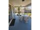 Screened in porch with wicker furniture and exterior view at 1472 Nantucket Rd, Venice, FL 34293