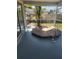 Screened in porch featuring built-in hot tub at 1472 Nantucket Rd, Venice, FL 34293