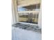 Exterior shot of a window with granite sill looking into the backyard at 1472 Nantucket Rd, Venice, FL 34293